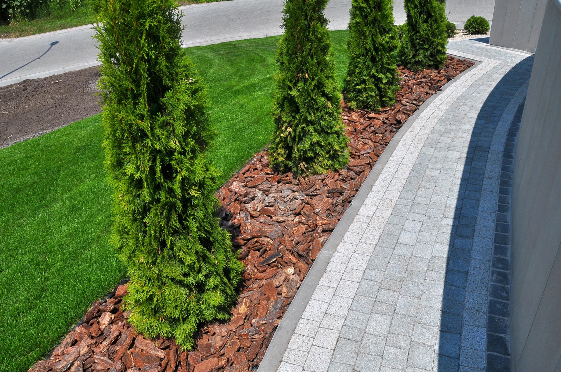 Stacked stone retaining wall with layered desert planting