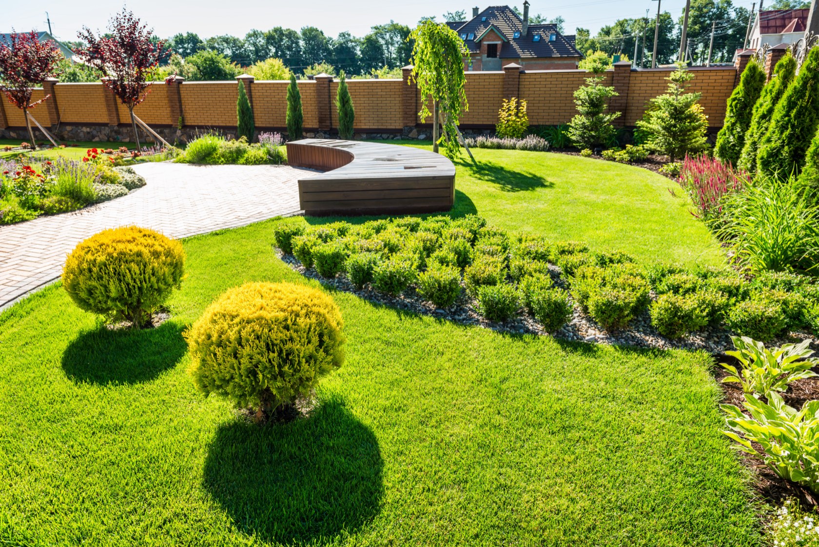 Modern backyard with patterned turf and geometric paver design